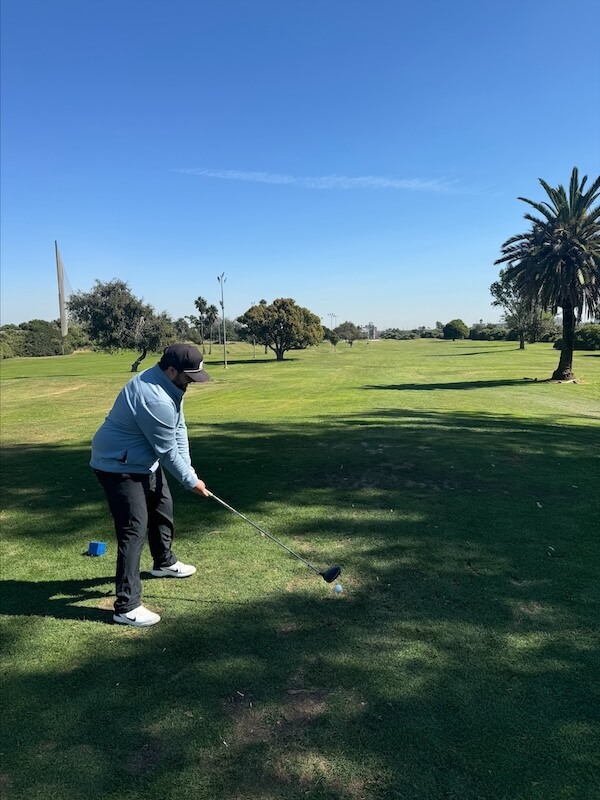 Alex golfing